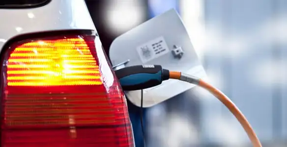 Electric car plugged into EV charger after professional installation in Albany, NY