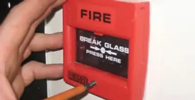 fire alarm installation service showing manual fire alarm pull station installed by licensed electricians in Albany, NY