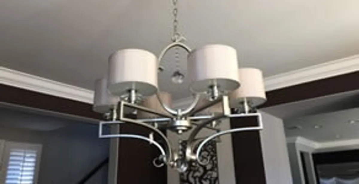 Modern chandelier installation with multiple light fixtures in Albany, NY