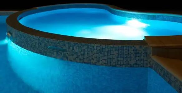 pool light installation and repair services highlighting illuminated pool interior lighting in Albany, NY