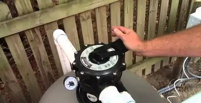 pool pumps service showing professional adjustment of pool pump control system in Albany, NY