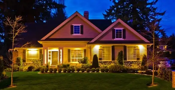 security light installation services illuminating a residential exterior at night in Albany, NY