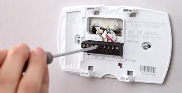 Thermostat installation service with proper wiring and secure wall mounting in Albany, NY