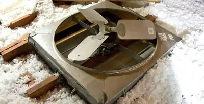 whole house fan installation services with attic-mounted ventilation unit in Albany, NY